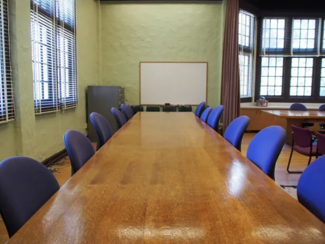 Table with chairs and whiteboard 